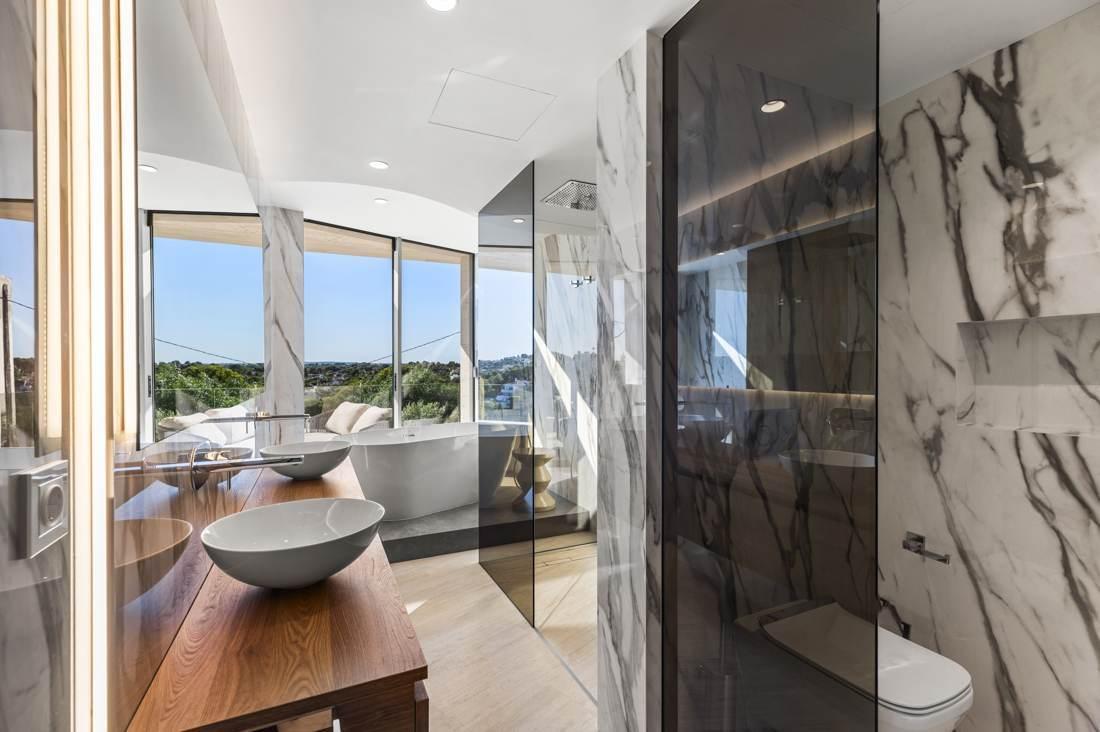 Book-matched marble, a bath positioned to the view.
